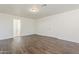 Bedroom with hardwood floors, fresh paint and an ensuite bathroom at 11016 W Griswold Rd, Peoria, AZ 85345