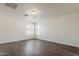 This bedroom features wood-look floors, two windows offering natural light and neutral paint at 11016 W Griswold Rd, Peoria, AZ 85345