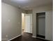 Bedroom featuring a closet with sliding doors and wood floors at 11016 W Griswold Rd, Peoria, AZ 85345