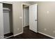 Bedroom with an open closet and wood floors at 11016 W Griswold Rd, Peoria, AZ 85345