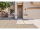 Close up on a home's front entryway and two car garage at 11016 W Griswold Rd, Peoria, AZ 85345