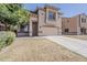 Inviting two-story home with a desert landscape, wide driveway, and attached two-car garage at 11016 W Griswold Rd, Peoria, AZ 85345