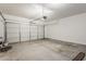 Clean and spacious garage with a large overhead door, ready for vehicles and storage at 11016 W Griswold Rd, Peoria, AZ 85345