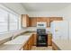 Bright kitchen featuring wooden cabinets, modern appliances and countertops at 11016 W Griswold Rd, Peoria, AZ 85345