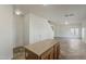 Open concept kitchen with island, tile floors, and view to the living area at 11016 W Griswold Rd, Peoria, AZ 85345