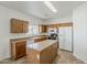 Bright kitchen with wood cabinetry, stainless steel appliances, and an island at 11016 W Griswold Rd, Peoria, AZ 85345