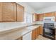 Kitchen featuring wood cabinets, granite countertops, and stainless steel appliances at 11016 W Griswold Rd, Peoria, AZ 85345