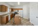 Kitchen featuring wooden cabinets, modern appliances, and a functional kitchen island at 11016 W Griswold Rd, Peoria, AZ 85345