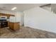 Well-lit kitchen featuring wood cabinets, white appliances, and a kitchen island at 11016 W Griswold Rd, Peoria, AZ 85345