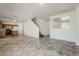 Large living area features a breakfast bar, kitchen access, and staircase at 11016 W Griswold Rd, Peoria, AZ 85345