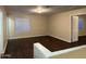 Open living area with lots of windows for natural light and vinyl floors at 11016 W Griswold Rd, Peoria, AZ 85345
