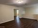 Cozy loft space offering versatile use with wood flooring and natural light throughout the room at 11016 W Griswold Rd, Peoria, AZ 85345