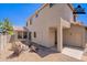 Backyard of a two-story home virtually staged with fire pit and chairs at 1244 S Tacoma --, Mesa, AZ 85209