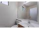 A simple bathroom boasts neutral paint, ample natural light and a bathtub with shower at 1244 S Tacoma --, Mesa, AZ 85209
