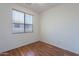 Bedroom with vinyl flooring, neutral paint and a window with mini blinds for natural light at 1244 S Tacoma --, Mesa, AZ 85209