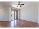 Bedroom with vinyl floors, a sliding glass door to balcony, and ceiling fan at 1244 S Tacoma --, Mesa, AZ 85209