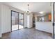 Cozy dining area featuring tile floors, sliding glass door, and kitchen access at 1244 S Tacoma --, Mesa, AZ 85209