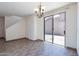 Dining area features tile floors, a modern chandelier, and sliding glass doors at 1244 S Tacoma --, Mesa, AZ 85209