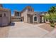 Inviting two-story home featuring a stone facade, balcony, and spacious driveway at 1244 S Tacoma --, Mesa, AZ 85209