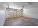 Clean, empty garage with automatic door opener, offering ample parking and storage at 1244 S Tacoma --, Mesa, AZ 85209