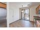 Bright kitchen with sliding glass door, tile floors, and stainless steel appliances at 1244 S Tacoma --, Mesa, AZ 85209
