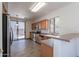 Well-lit kitchen featuring tile floors, stainless appliances, and backyard access at 1244 S Tacoma --, Mesa, AZ 85209