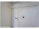 Functional laundry room with overhead shelving and connections for washer and dryer at 1244 S Tacoma --, Mesa, AZ 85209