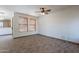 Bright living room with tiled floor, and natural light from the two windows at 1244 S Tacoma --, Mesa, AZ 85209