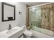 Bathroom with a glass enclosed shower, modern toilet, and a stylish vanity at 13631 N 70Th Dr, Peoria, AZ 85381