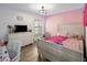 Cozy bedroom with laminate floors, neutral colored furniture, and neon rope lighting at 13631 N 70Th Dr, Peoria, AZ 85381