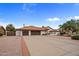 Spacious home showcases a tile roof, three-car garage, and mature trees at 13631 N 70Th Dr, Peoria, AZ 85381