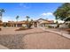 Elegant home with a tile roof, desert landscaping, and a circular driveway at 13631 N 70Th Dr, Peoria, AZ 85381