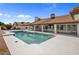 Beautiful backyard pool with a tanning ledge and covered patio at 13631 N 70Th Dr, Peoria, AZ 85381