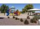 Community playground with a blue slide, red staircase, and colorful play structure, providing fun for all at 1416 E Edwin St, Casa Grande, AZ 85122