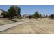 Scenic community walking path surrounded by lush green spaces and beautiful homes at 1416 E Edwin St, Casa Grande, AZ 85122