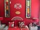 Vibrant bedroom featuring a red color scheme, decorative pillows, and unique artwork at 14950 W Mountain View Blvd # 5303, Surprise, AZ 85374