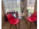 Charming breakfast nook with bright red chairs, a glass table, and natural light at 14950 W Mountain View Blvd # 5303, Surprise, AZ 85374