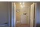 Hallway featuring white doors, neutral walls, and a modern light fixture at 14950 W Mountain View Blvd # 5303, Surprise, AZ 85374