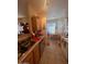 Spacious kitchen featuring wood cabinets, tile flooring, and a cozy breakfast nook at 14950 W Mountain View Blvd # 5303, Surprise, AZ 85374