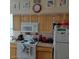 Functional kitchen with white appliances, light wood cabinets, and ample counter space at 14950 W Mountain View Blvd # 5303, Surprise, AZ 85374