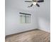 Bedroom with a ceiling fan, laminate floors, and a bright window at 16620 S 48Th St # 79, Phoenix, AZ 85048