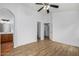 Bedroom featuring wood flooring, neutral walls, an ensuite bathroom, and closet space at 16620 S 48Th St # 79, Phoenix, AZ 85048