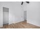 Bright bedroom showcasing laminate flooring, a ceiling fan and a closet at 16620 S 48Th St # 79, Phoenix, AZ 85048