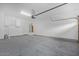 Spacious two-car garage with epoxy flooring, and a water heater at 16620 S 48Th St # 79, Phoenix, AZ 85048