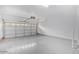Spacious two-car garage with epoxy flooring and a garage door at 16620 S 48Th St # 79, Phoenix, AZ 85048
