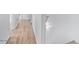 Hallway featuring durable laminate flooring, leading to other rooms at 16620 S 48Th St # 79, Phoenix, AZ 85048