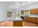 Well-lit kitchen featuring cabinets, backsplash, and large island at 16620 S 48Th St # 79, Phoenix, AZ 85048