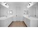 Bright bathroom with double vanities, quartz countertops, and a minimalist design at 16810 W Yucatan Dr, Surprise, AZ 85388