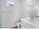 Bright bathroom featuring single sink vanity, modern fixtures, and walk-in shower at 16810 W Yucatan Dr, Surprise, AZ 85388
