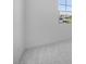 Corner of a bedroom with plush gray carpet and a view of the outdoors from the window at 16810 W Yucatan Dr, Surprise, AZ 85388